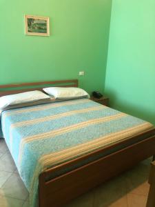 Postel nebo postele na pokoji v ubytování Il Portichetto