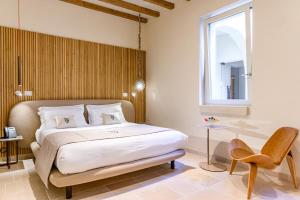 Postel nebo postele na pokoji v ubytování Pollicastro Boutique Hotel