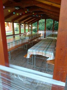 a row of tables sitting inside of a building at Brunarica in Globoko +25 photos