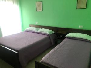 Postel nebo postele na pokoji v ubytování Il Portichetto