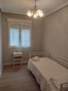 Łóżko lub łóżka w pokoju w obiekcie Las Ildas