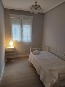 Łóżko lub łóżka w pokoju w obiekcie Las Ildas