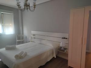 Łóżko lub łóżka w pokoju w obiekcie Las Ildas