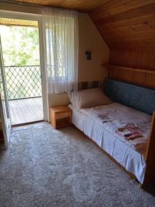 Postel nebo postele na pokoji v ubytování Borostyán Vendégház Dunasziget
