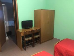 TV a/nebo společenská místnost v ubytování Il Portichetto