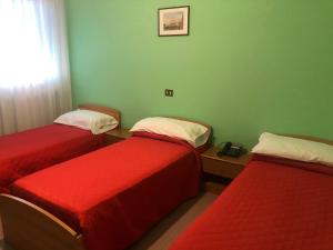 Postel nebo postele na pokoji v ubytování Il Portichetto