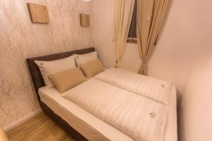 Ένα ή περισσότερα κρεβάτια σε δωμάτιο στο Family Apartmani Kopaonik