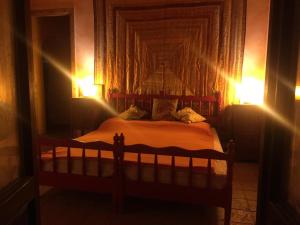 Postel nebo postele na pokoji v ubytování Bed and Breakfast Balli coi Lupi