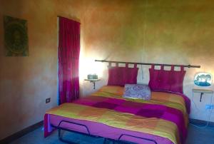 Postel nebo postele na pokoji v ubytování Bed and Breakfast Balli coi Lupi