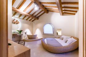 Postel nebo postele na pokoji v ubytování Pollicastro Boutique Hotel