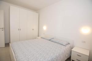 Postel nebo postele na pokoji v ubytování Appartamenti Laly + 51 fotografií