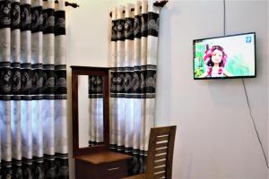 TV a/nebo společenská místnost v ubytování Sky White Villa