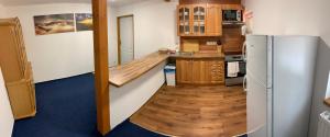 Kuchyňa alebo kuchynka v ubytovaní Apartmány u Michala