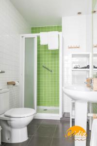 a bathroom with a shower and a toilet and a sink at Apartamento Floral by Cadiz Time in Cádiz