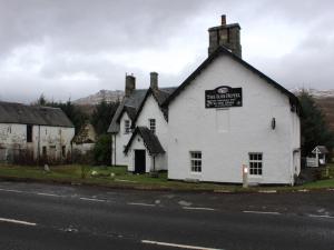 a white building on the side of a street at Luib Hotel in Killin