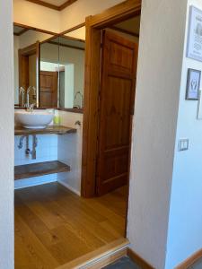 a bathroom with a sink and a mirror at Palazzo Bolasco in Alghero