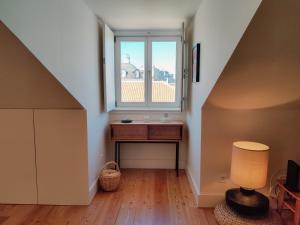 a room with a table and a window at FLH Downtown Modern Apartment in Lisbon