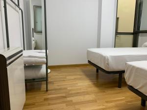 Postel nebo postele na pokoji v ubytování Oktheway Pedro Saco Street