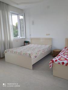 Postel nebo postele na pokoji v ubytování Emzari's Apartment