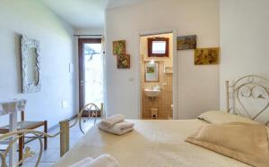 A bed or beds in a room at Camere a sud est