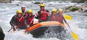 a group of people in a raft in a river at L'OURSERIE Bed & Breakfast in Saint-Paul-en-Chablais