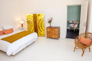 Ein Bett oder Betten in einem Zimmer der Unterkunft Les Sorbiers