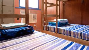 Кровать или кровати в номере Maracanã Hostel