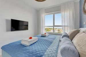 Posteľ alebo postele v izbe v ubytovaní Baltica SeaView by TriApart