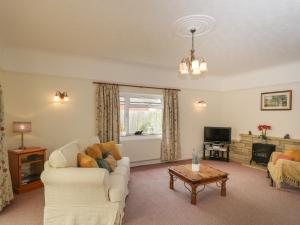 a living room with a couch and a coffee table at Downs View in Warminster