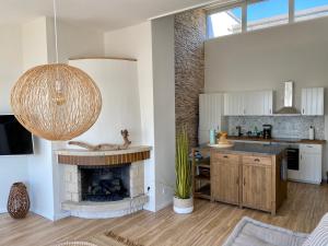 Kuchyň nebo kuchyňský kout v ubytování COAST HOUSE Sky Suite