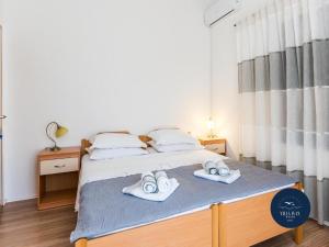 Postel nebo postele na pokoji v ubytování Villa Ivan
