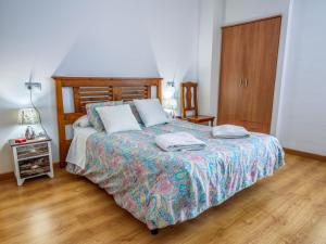 A bed or beds in a room at Chalet in La Omañuela near Ski Resort