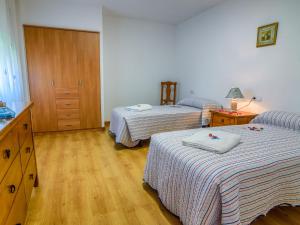 A bed or beds in a room at Chalet in La Omañuela near Ski Resort