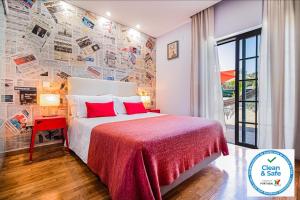 Кровать или кровати в номере Buganvilias Do Meco Guest house