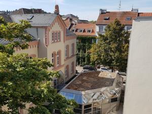 an overhead view of a building with a roof at Nauwieser Apartments in Saarbrücken