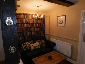 a living room with a couch and a coffee table at The Nags Head in Norwich