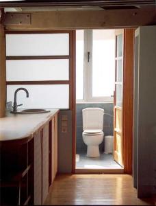 a bathroom with a toilet and a sink at Villa Catani in Kalamaki Chanion