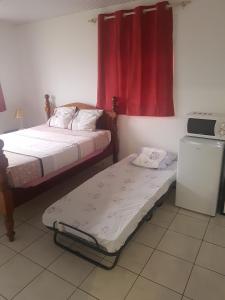 Una cama o camas en una habitación de MANIKOU