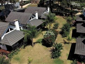 an overhead view of a house with trees and plants at Bungalows Punta Colorada in Piriápolis