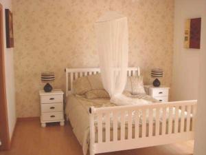 Cama o camas de una habitación en Villa dos Eucaliptos - Sao Martinho do Porto