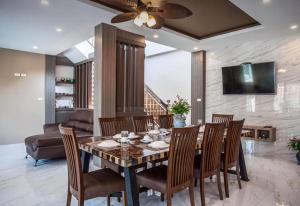 a dining room with a table and chairs at Poonsiri Private Pool Villa Aonang in Ao Nang Beach