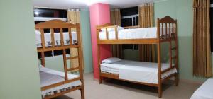 a room with two bunk beds in a room at Hotel Internacional en Atacames in Atacames