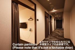 a corridor of a hotel room with a curtain note that it at HOTEL THE ROCK in Osaka +34 photos