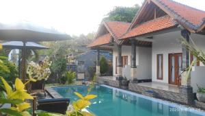 The swimming pool at or near Miko Bali Bungalow