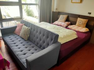 Voodi või voodid majutusasutuse Formosa Backpackers Hostel & Apartment（青年民宿） toas