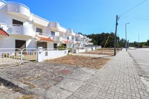 an empty street in front of a building at Casa da Bene - House Near the Amorosa Beach with Seaview in Viana do Castelo