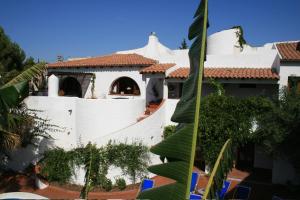 a view of a house with a white wall at Hotel Villa Mediterranea in Noto Marina +16 photos