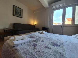 Postel nebo postele na pokoji v ubytování Rooms Čapo Rab