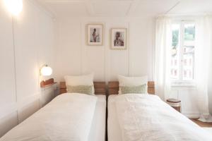 מיטה או מיטות בחדר ב-Villa Donkey Ferienwohnung 113