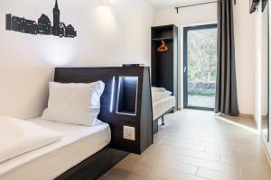 Postel nebo postele na pokoji v ubytování Augustus Hotel Bernkastel - Comfortable Budget Hotel